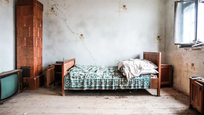 Bedroom in a state of disrepair