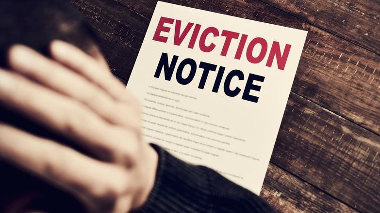 Man reading an evicition notice