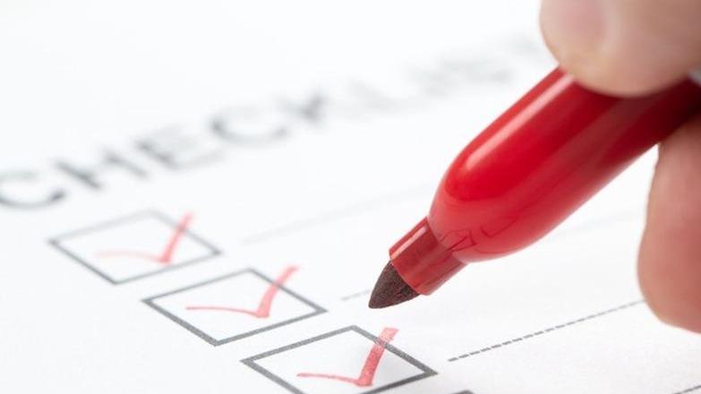 Checklist with red pen