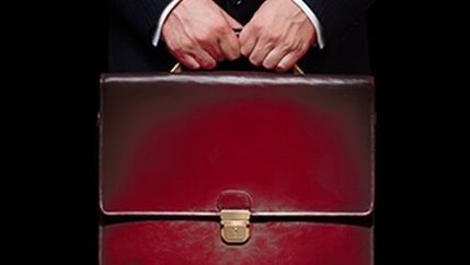 Man holding red briefcase