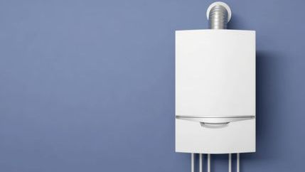 Boiler installed on a blue wall