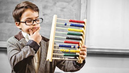 Child holding abacus