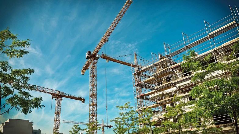 Cranes building a high-rise block