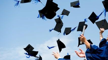 Qualification mortar boards thrown in air