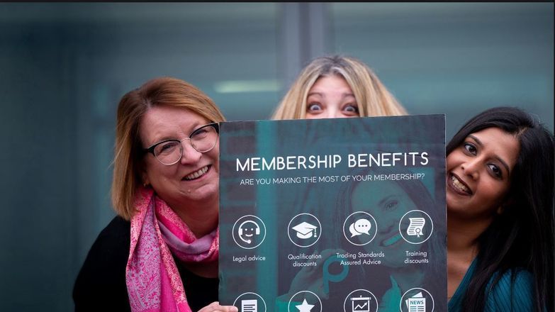 Membership team displaying benefits