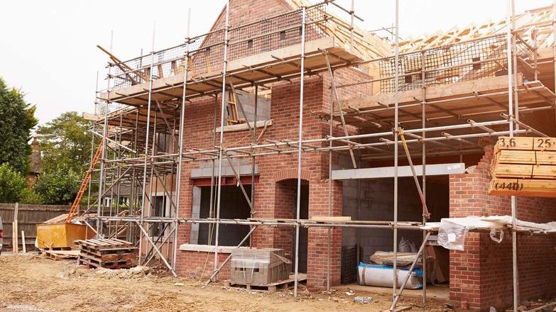 House under construction with scaffolding