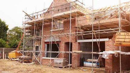 House under construction with scaffolding